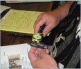 Doug Seneker analyzes artifacts associated with Battle of Wilson's Creek.